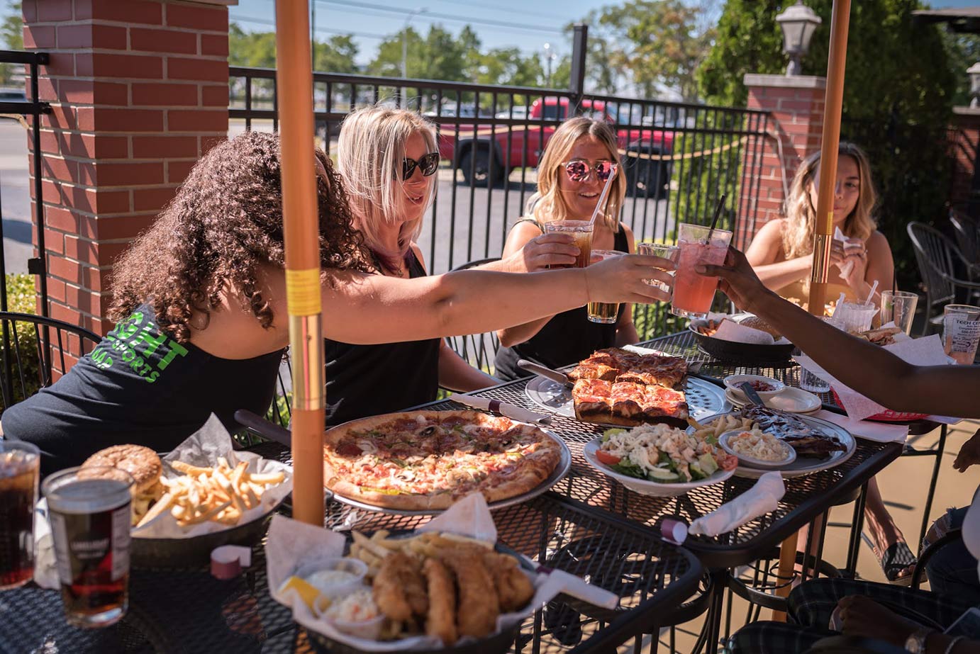 People eating and drinking in an outdoor patio